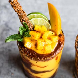 Homemade tamarind straws in glass of mangonada.