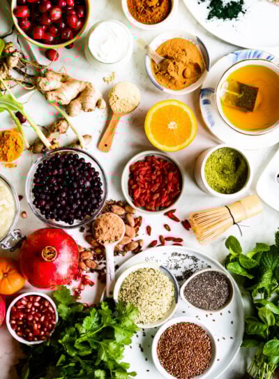 white counter full of bowls of different superfoods.